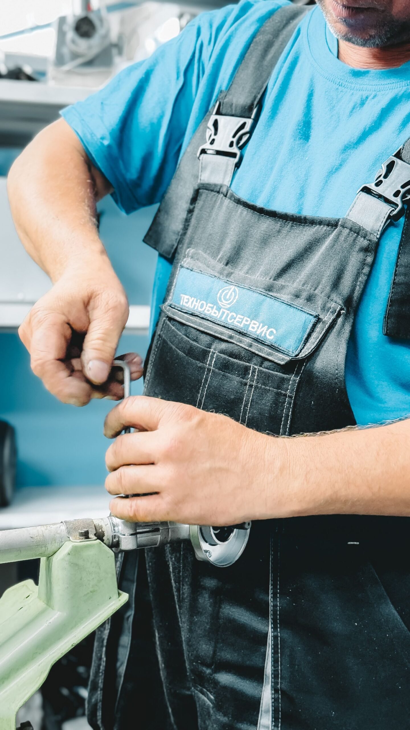 Plumber working on a pipe with a wrench